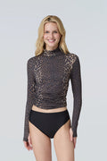A woman wearing a long-sleeve mock neck rashguard in leopard and black bikini bottom