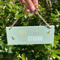 bee kind bee strong ceramic hanging sign with pale green finish and bee design