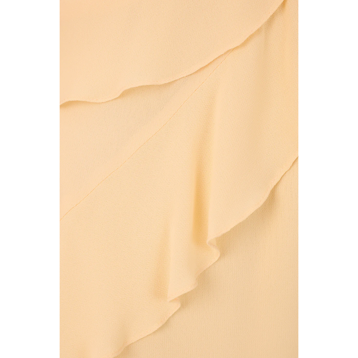 Close-up of beige fabric with ruffled layers