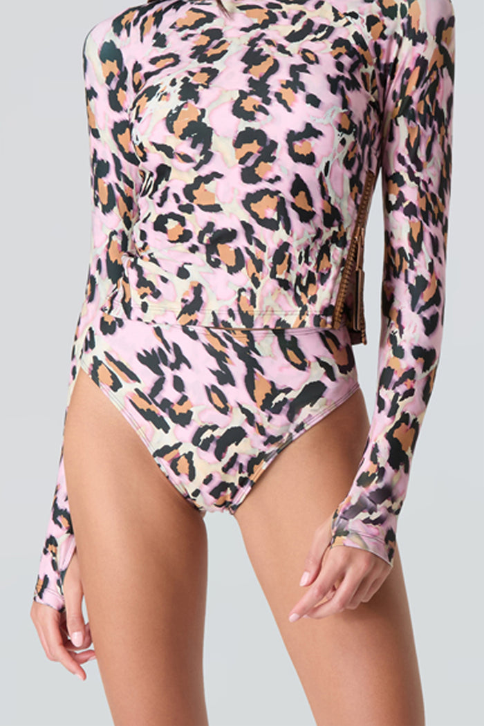 Pink leopard print long sleeve swim top and swim bikini bottom on a gray background