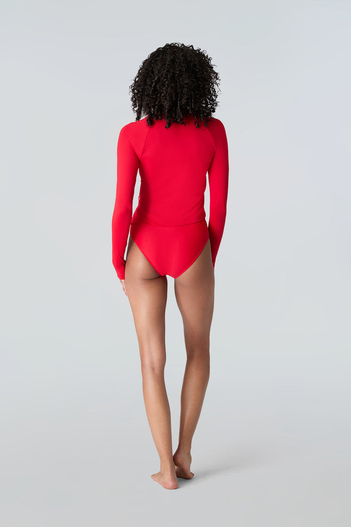 Woman in Watskin Sasha tee and Belle bikini bottom in Red