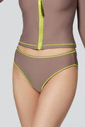 Woman modeling Watskin Sophie cropped jacket and Belle bikini brief in Taupe with neon piping.