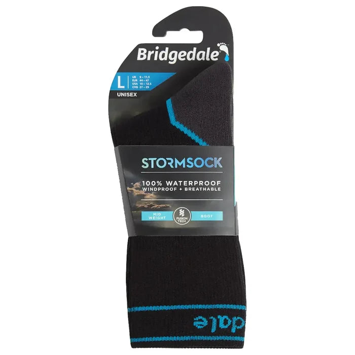 Packaged Bridgedale Storm Waterproof Socks Midweight in black/blue, labeled as 100% waterproof, breathable, and windproof for unisex use.  from  John Bull Clothing