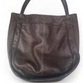 Brown leather handbag with leopard inside