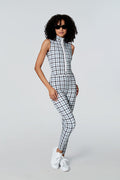Woman in sunglasses modeling Watskin Chloe sleeveless catsuit in Gray Houndstooth