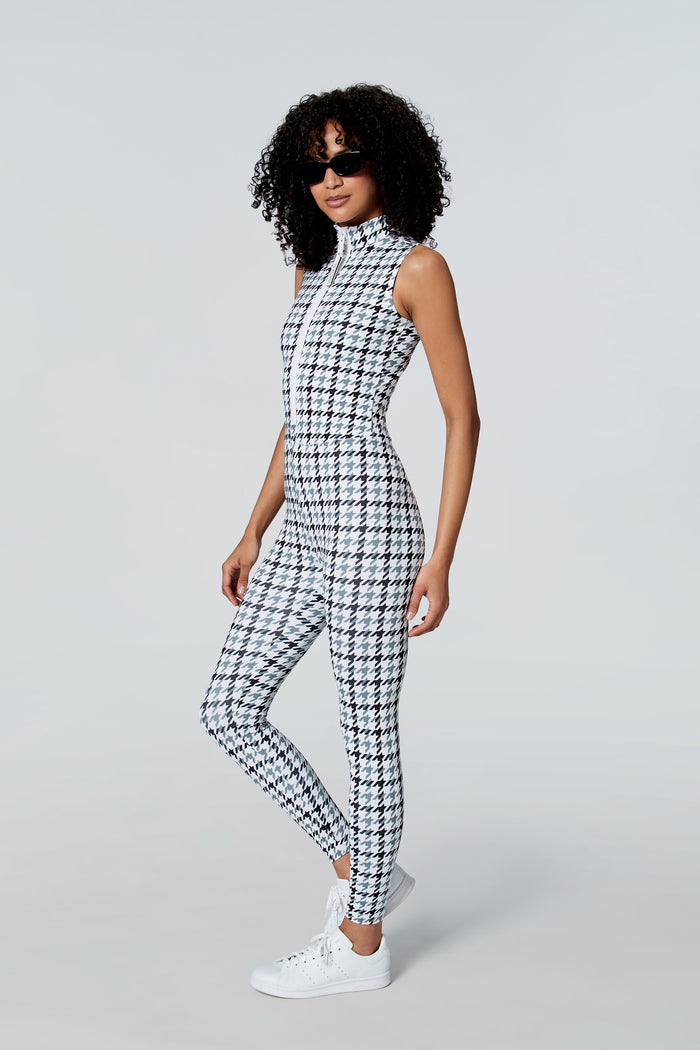 Woman in sunglasses wearing Watskin  Chloe sleeveless catsuit in Gray Houndstooth