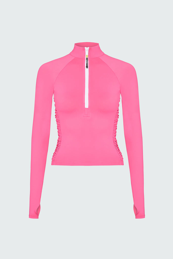 A pink long-sleeve 1/2 zip rashguard with side ruching