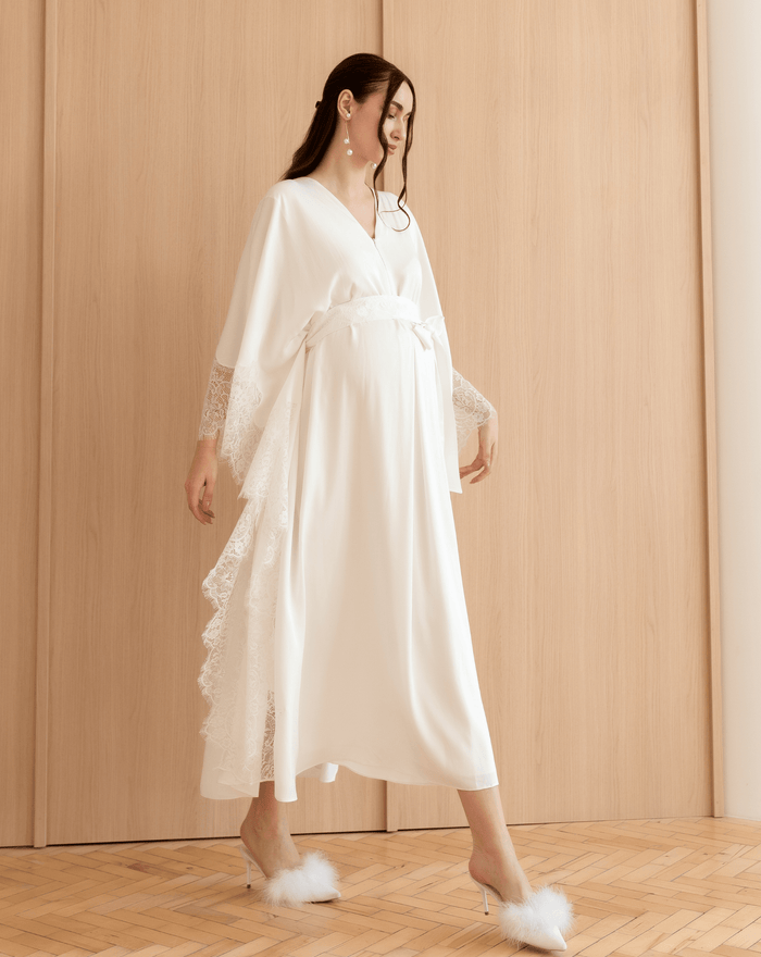 A dynamic walking shot of the Cotton Kaftan, capturing the effortless elegance and movement of the natural material.