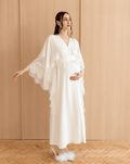 Full-length pose with hands on the belly and raised, illustrating the perfect balance of function and classic style.