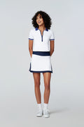 Model wearing Watskin Emma Polo Tee and Jojo tennis skirt