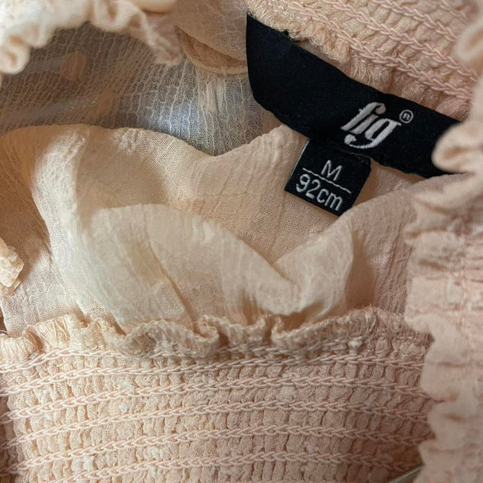 Fig pink blouse with ruffle