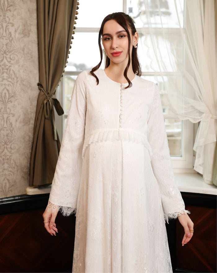 A mid-length view with hands down, emphasizing the modest cut and the seamless lace coverage across the silhouette.