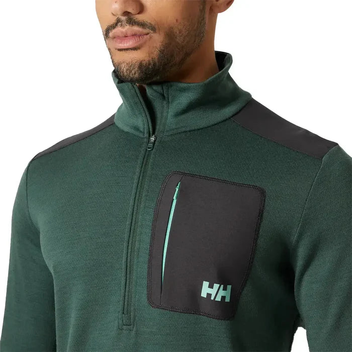Close-up of Helly Hansen Lifa Merino Wool Mid Layer 1/2 Zip chest pocket with HH logo and contrast zipper, highlighting functional outdoor design.  from  John Bull Clothing