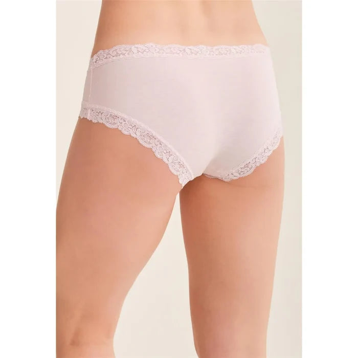 White lace-trimmed underwear on a beige background