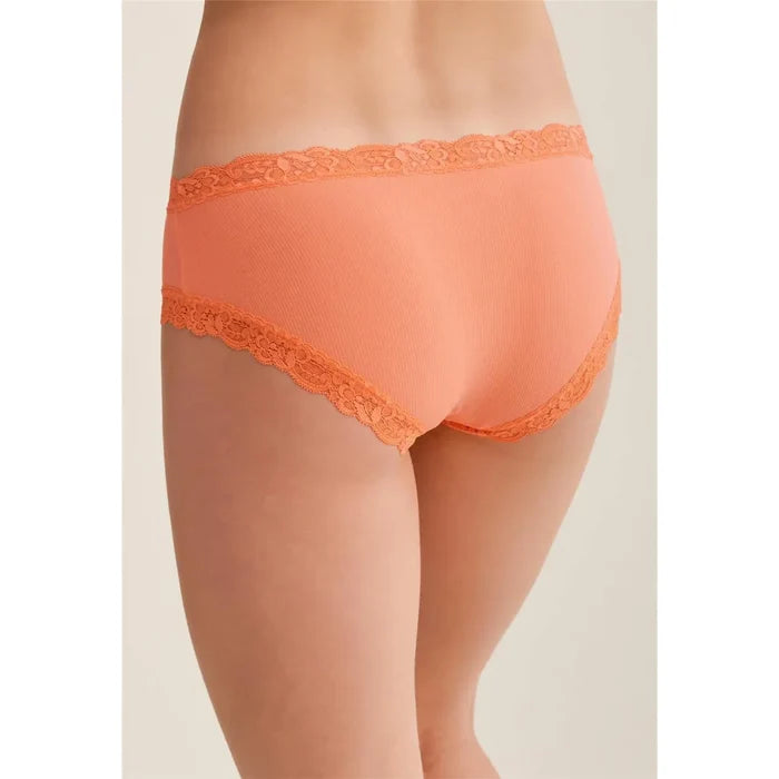 Orange lace underwear on a neutral background