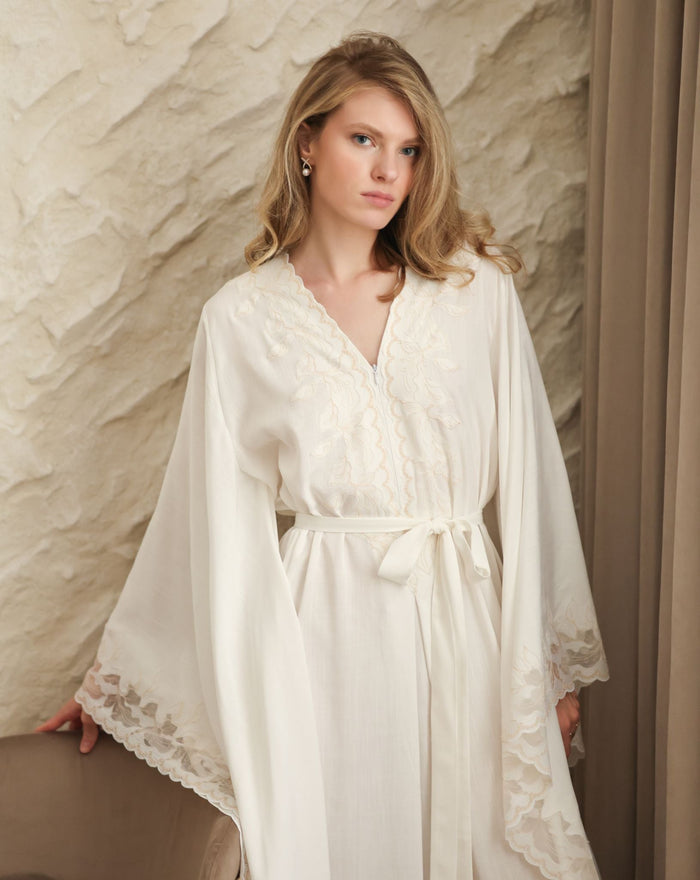A Cotton Kaftan shown in a waist-up view, highlighting the breathable fabric and elegant high neckline.