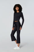 Female model wearing Watskin Luna crop pant and Clara tee in black