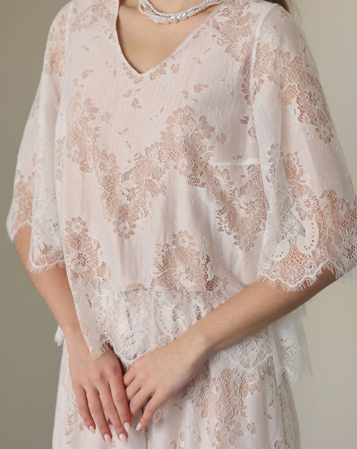 A detailed shot of the flowing top, focusing on the subtle floral patterns and breathable cotton lining.