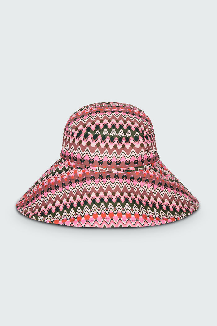 Pink and green wavy striped patterned wide brimmed sun hat on a white background