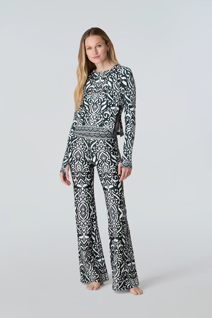 Blonde woman wearing Sasha tee and Juliette Palazzo Pants in Black Ikat
