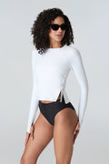 Woman in sunglasses wearing Watskin Sasha tee in White and Belle bikini in Black