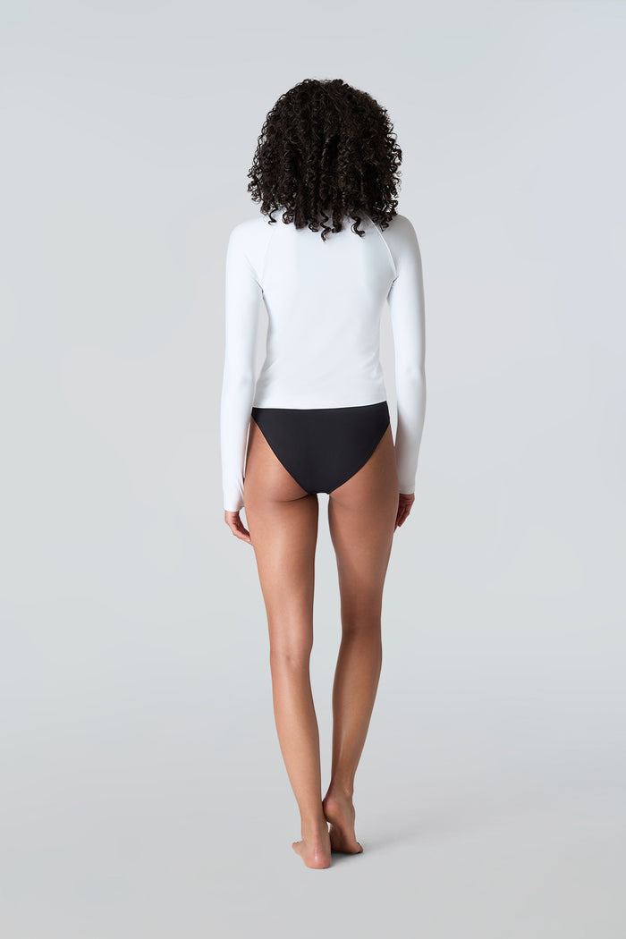 Rear view of woman wearing Sasha tee in White and Belle bikini in Black