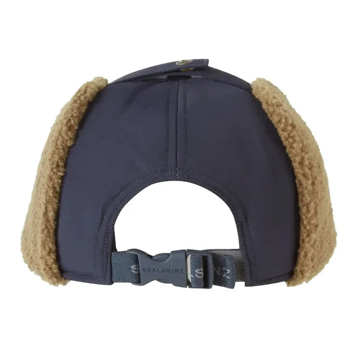 Rear view of navy Sealskinz Upton WP Extreme Cold Weather Puffer Hat featuring adjustable buckle and cozy fleece ear flaps for winter wear.  from  John Bull Clothing
