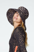 Profile shot of female modeling Watskin Sienna Hat and Sasha rashguard tee in Leopard