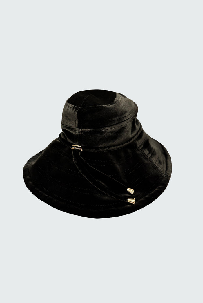 Watskin Sienna black velvet sunhat with cord detailing and gold hardware shown against a light background