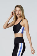 Model wearing Watskin Vivi bra and Serena leggings in Blue Colorblock