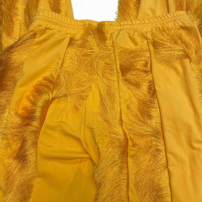 Yellow feathered sweatpants with fringe