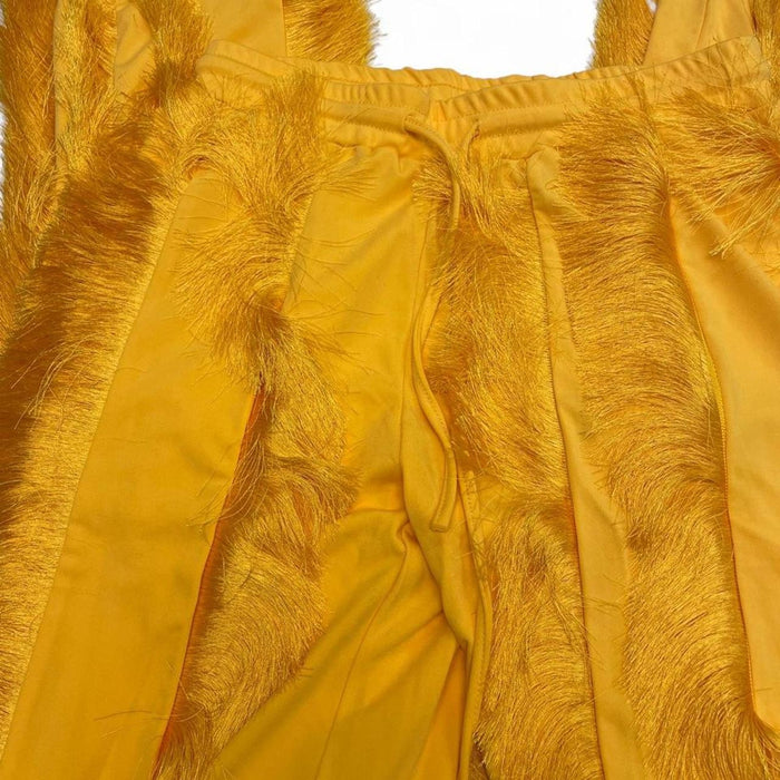 Yellow feathered sweatpants with fringe