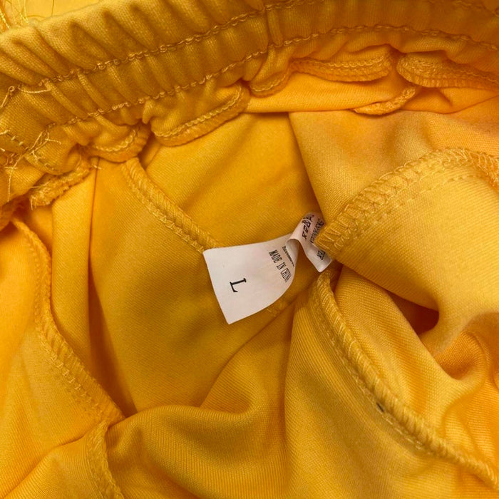Yellow feathered sweatpants with fringe