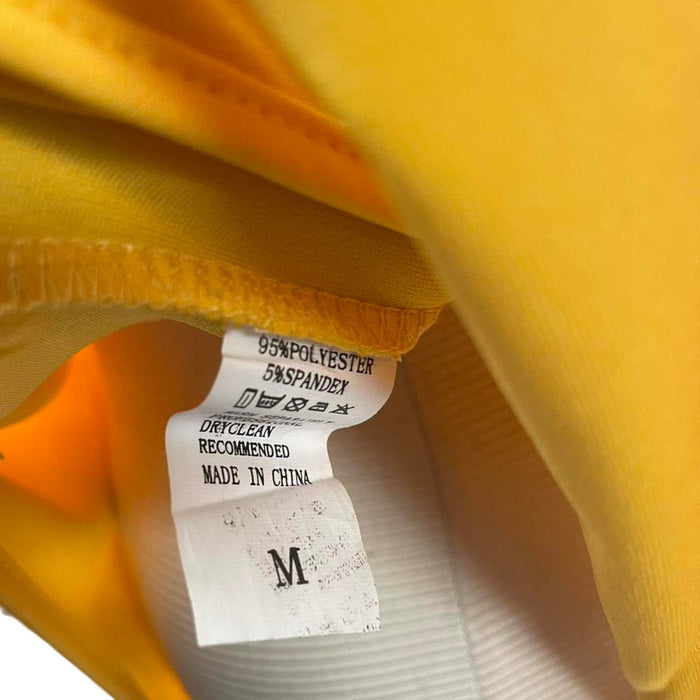 Yellow long sleeve bodysuit
